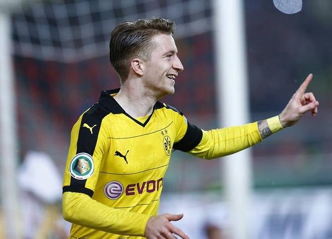 Reus goals crucial as Dortmund hunt leaders Bayern