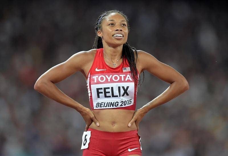 Allyson Felix (USA) celebrates after winning the women's 400m in