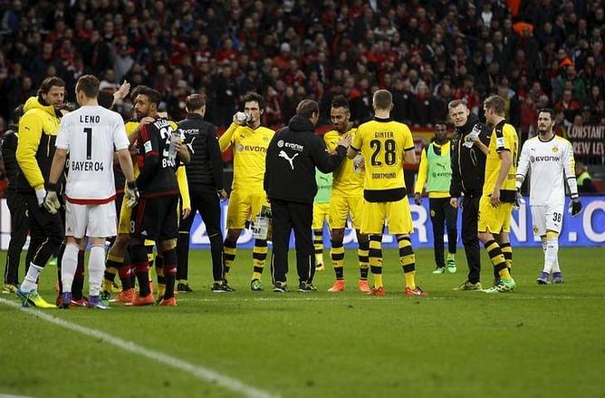 Referee briefly halts Dortmund game at Leverkusen