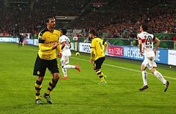 Borussia Dortmund fans stage ticket price protest by throwing tennis balls onto the pitch