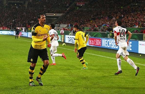 Borussia Dortmund fans stage ticket price protest by throwing tennis balls onto the pitch