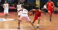 Siddhant Shinde of Pune Peshwas (in red) goes behind the back against Haryana Gold (in white)