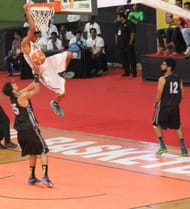 Nikhil of Mumbai Challengers throws down a two handed dunk in transition against Punjab Steelers