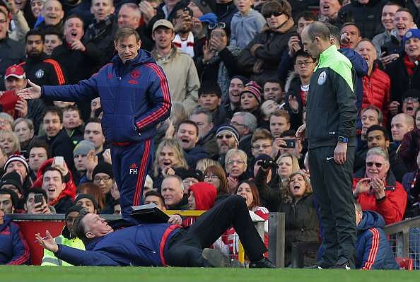 Louis Van Gaal apologises for dramatic fall on sidelines