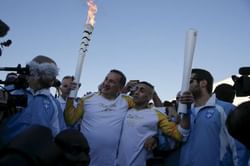 Rio Olympics 2016: Syrian amputee swimmer carries Olympic flame through Athens refugee camp