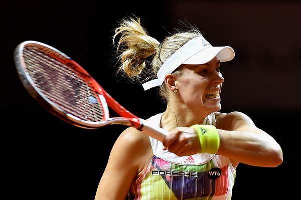 WTA Stuttgart: Kerber survives scare, easy win for Muguruza