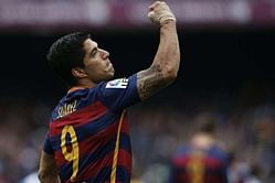 Suarez hails team spirit at title-chasing Barcelona