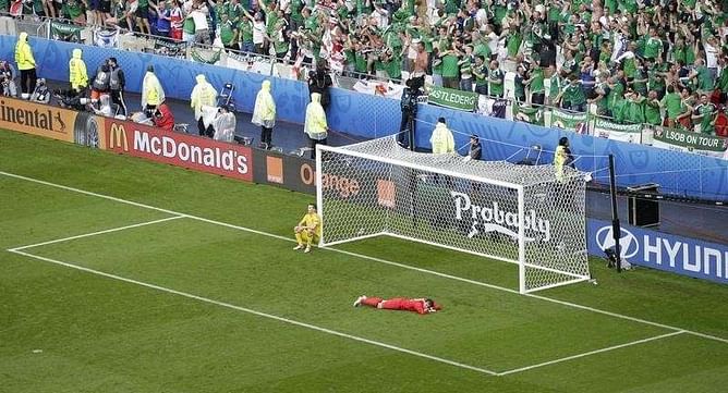 Gritty Northern Ireland sink Ukraine in stormy Lyon