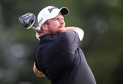 Lowry leads U.S. Open by two after marathon day