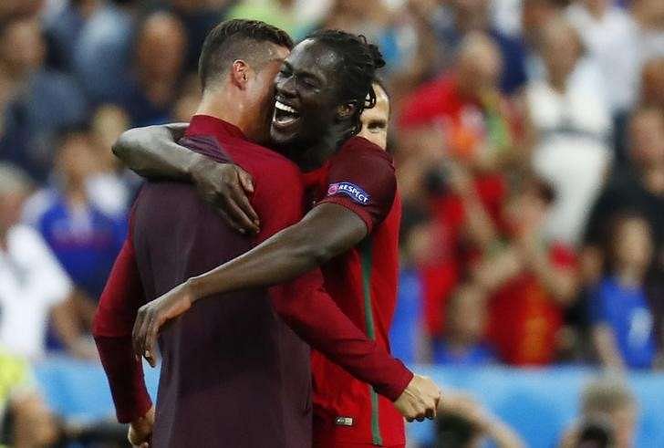 Football Soccer - Portugal v France - EURO 2016 - Final - Stade de France, Saint-Denis near Paris, France - 10/7/16 Portugal&#039;s Cristiano Ronaldo and Eder celebrate after winning Euro 2016 REUTERS/Kai Pfaffenbach/ Livepic