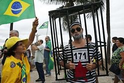 Rio beach protest calls for ouster of suspended president