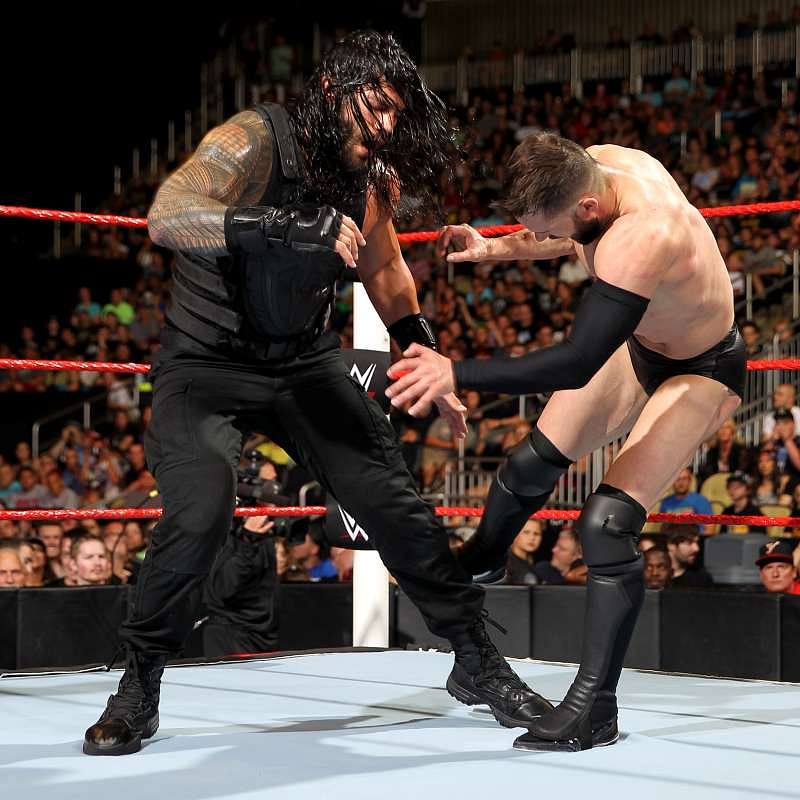Roman Reigns vs Finn Bálor photos