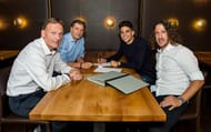 marc batrra and carles puyol of barcelona sign for borussia dortmund