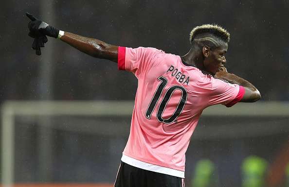 Manchester United fan gets his adidas kit signed by Paul Pogba