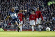 MANCHESTER - FEBRUARY 15: Sylvain Wiltord of Arsenal scores the second goal during the FA Cup fifth round match between Manchester United and Arsenal at Old Trafford, Manchester, England on February 15, 2003. (Photo by Gary M. Prior/Getty Images)