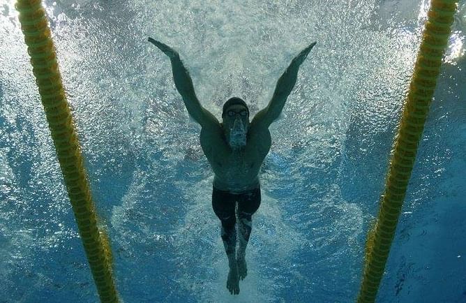 Swimming: Mischievous Phelps leaves door ajar for sixth Games