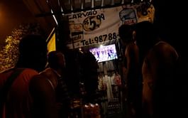 In favela above opening ceremony, pride and disappointment