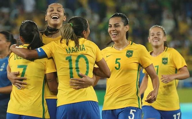 Soccer - U.S. women march on, Brazil impress