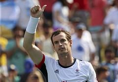 Britain's Murray eases into third round, Ferrer eliminated