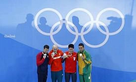 Swimming - Stunning Phelps, Schooling wins Singapore's first gold