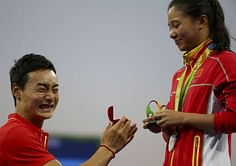 In twist, Chinese divers get engaged on Olympic medal stage