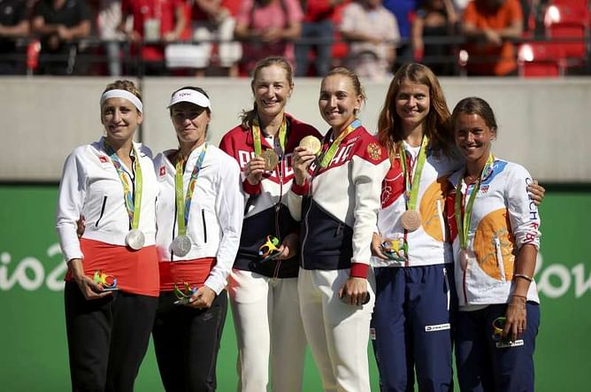 Hingis adds silver medal to rich career storyline