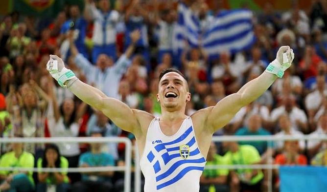 Gymnastics: Petrounias flexes his muscles to win rings gold