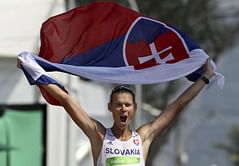 Toth overhauls Tallent to win 50km walk gold