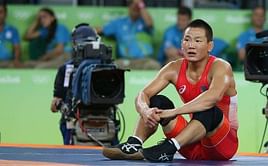 Wrestling - U.S. grab last gold, Mongolian strip-off steals show