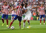 LISBON, PORTUGAL - MAY 24: Diego Costa of Club Atletico de Madrid holds off Sami Khedira of Real Madrid during the UEFA Champions League Final between Real Madrid and Atletico de Madrid at Estadio da Luz on May 24, 2014 in Lisbon, Portugal. (Photo by Shaun Botterill/Getty Images)