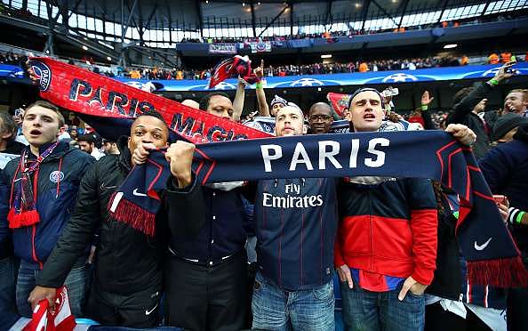 MANCHESTER, ENGLAND - APRIL 12:  PSG fans show their support prior to the UEFA Champions League quarter final second leg match between Manchester City FC and Paris Saint-Germain at the Etihad Stadium on April 12, 2016 in Manchester, United Kingdom.  (Photo by Clive Brunskill/Getty Images)