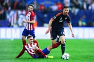 MADRID, SPAIN - APRIL 27: Xabi Alonso of FC Bayern Muenchen competes for the ball with Antoine Griezmann of Atletico de Madrid during the UEFA Champions League semi final first leg match between Club Atletico de Madrid and FC Bayern Muenchen at Vincente Calderon on April 27, 2016 in Madrid, Spain. (Photo by David Ramos/Getty Images)