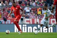 MUNICH, GERMANY - APRIL 30: Jerome Boateng of Muenchen (L) is challenged by Raffael of Moenchengladbach during the Bundesliga match between FC Bayern Muenchen and Borussia Moenchengladbach at Allianz Arena on April 30, 2016 in Munich, Germany. (Photo by Daniel Kopatsch/Getty Images For MAN)