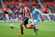SOUTHAMPTON, ENGLAND - MAY 01: Jordy Clasie of Southampton evades Samir Nasri of Manchester City during the Barclays Premier League match between Southampton and Manchester City at St Mary's Stadium on May 1, 2016 in Southampton, England. (Photo by Mike Hewitt/Getty Images)
