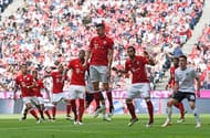 MUNICH, GERMANY - MAY 14: Robert Lewandowski of Muenchen (C) jumps for a header during the Bundesliga match between FC Bayern Muenchen and Hannover 96 at Allianz Arena on May 14, 2016 in Munich, Germany. (Photo by Daniel Kopatsch/Getty Images For MAN)