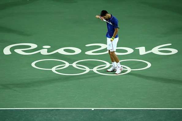 RIO DE JANEIRO, BRAZIL - AUGUST 07:  Novak Djokovic of Serbia reacts during his match against Juan Martin Del Potro of Argentina in their singles match on Day 2 of the Rio 2016 Olympic Games at the Olympic Tennis Centre on August 7, 2016 in Rio de Janeiro, Brazil.  (Photo by Cameron Spencer/Getty Images)