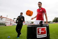 MUNICH, BAVARIA - AUGUST 10: Mats Hummels juggles with a cube during the DFL Media Day keepy uppy relay on August, 10, 2016 in Munich, Germany. (Photo by Jan Hetfleisch/Getty Images for DFL)