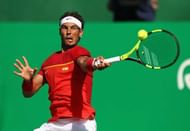 RIO DE JANEIRO, BRAZIL - AUGUST 14: Rafael Nadal of Spain returns a forehand during the singles bronze medal match against Kei Nishikori of Japan on Day 9 of the Rio 2016 Olympic Games at the Olympic Tennis Centre on August 14, 2016 in Rio de Janeiro, Brazil. (Photo by Julian Finney/Getty Images)