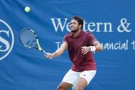 MASON, OH - AUGUST 18: Jo-Wilfried Tsonga of France hits a return to Steve Johnson of the United States during a third round match on Day 6 of the Western & Southern Open at the Lindner Family Tennis Center on August 18, 2016 in Mason, Ohio. Johnson defeated Tsonga 6-3, 7-6. (Photo by Joe Robbins/Getty Images)