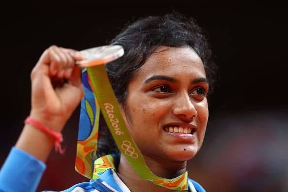 RIO DE JANEIRO, BRAZIL - AUGUST 19:  Silver medalist V. Sindhu Pusarla of India celebrates during the medal ceremony after the Women's Singles Badminton competition on Day 14 of the Rio 2016 Olympic Games at Riocentro - Pavilion 4 on August 19, 2016 in Rio de Janeiro, Brazil.  (Photo by Clive Brunskill/Getty Images)