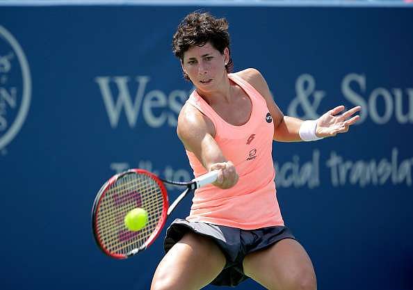 MASON, OH - AUGUST 19:  Carla Suarez Navarro of Spain hits a return during her quarterfinal match against Angelique Kerber during day 7 of the Western &amp; Southern Open at the Lindner Family Tennis Center  on August 19, 2016 in Mason, Ohio.  (Photo by Andy Lyons/Getty Images)