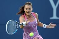 NEW HAVEN, CT - AUGUST 23: Agnieszka Radwanska of Poland returns a shot to Jelena Ostapenko of Latvia during her mach on day 3 of the Connecticut Open at the Connecticut Tennis Center at Yale on August 23, 2016 in New Haven, Connecticut. (Photo by Adam Glanzman/Getty Images)
