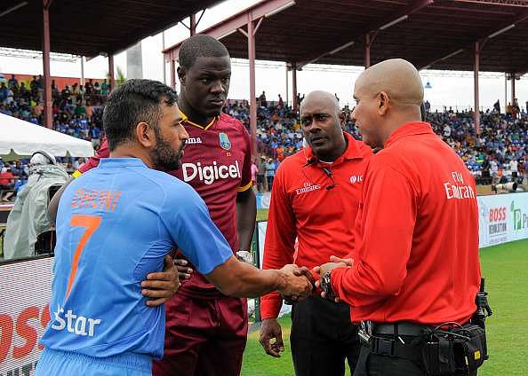 Captains Carlos Brathwaite and MS Dhoni in disagreement over state of outfield
