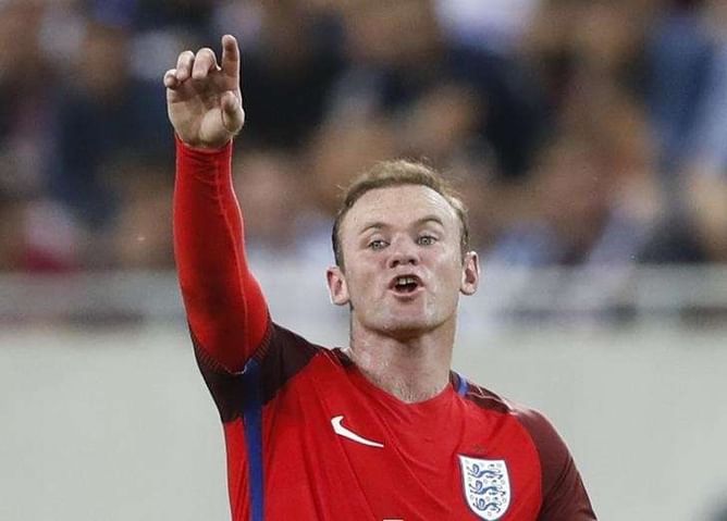 Rooney defends England role after win over Slovakia