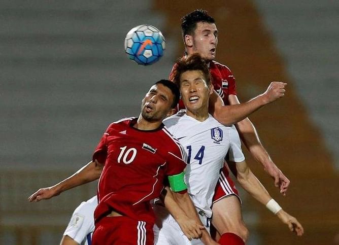 Soccer - Syrians stifle Korea, Japan back on track