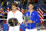 NEW YORK, NY - SEPTEMBER 13: Novak Djokovic of Serbia, right, and Roger Federer of Switzerland celebrate with thier trophies after their Men's Singles Final match on Day Fourteen of the 2015 US Open at the USTA Billie Jean King National Tennis Center on September 13, 2015 in the Flushing neighborhood of the Queens borough of New York City. Djokovic defeated Federer 6-4, 5-7, 6-4, 6-4. (Photo by Clive Brunskill/Getty Images)