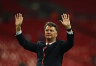 LONDON, ENGLAND - MAY 21: Louis van Gaal Manager of Manchester United salutes the fans after winning The Emirates FA Cup Final match between Manchester United and Crystal Palace at Wembley Stadium on May 21, 2016 in London, England. Man Utd won 2-1 after extra time. (Photo by Paul Gilham/Getty Images)