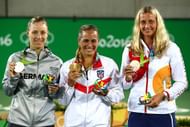 RIO DE JANEIRO, BRAZIL - AUGUST 13: (L-R) Silver medalist Angelique Kerber of Germany, gold medalist Monica Puig of Puerto Rico and bronze medalist Petra Kvitova of the Czech Republic pose during the medal ceremony for Women's Singles on Day 8 of the Rio 2016 Olympic Games at the Olympic Tennis Centre on August 13, 2016 in Rio de Janeiro, Brazil. (Photo by Clive Brunskill/Getty Images)