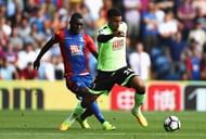 LONDON, ENGLAND - AUGUST 27: Lewis Grabban of AFC Bournemouth takes the ball away from Christian Benteke of Crystal Palace during the Premier League match between Crystal Palace and AFC Bournemouth at Selhurst Park on August 27, 2016 in London, England. (Photo by Bryn Lennon/Getty Images)