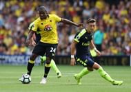 WATFORD, ENGLAND - AUGUST 27: Odion Ighalo of Watford moves away from Mesut Ozil during the Premier League match between Watford and Arsenal at Vicarage Road on August 27, 2016 in Watford, England. (Photo by David Rogers/Getty Images)